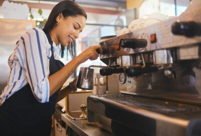 Coffee shop, cafe and restaurant with a barista working as a startup entrepreneur and small busines
