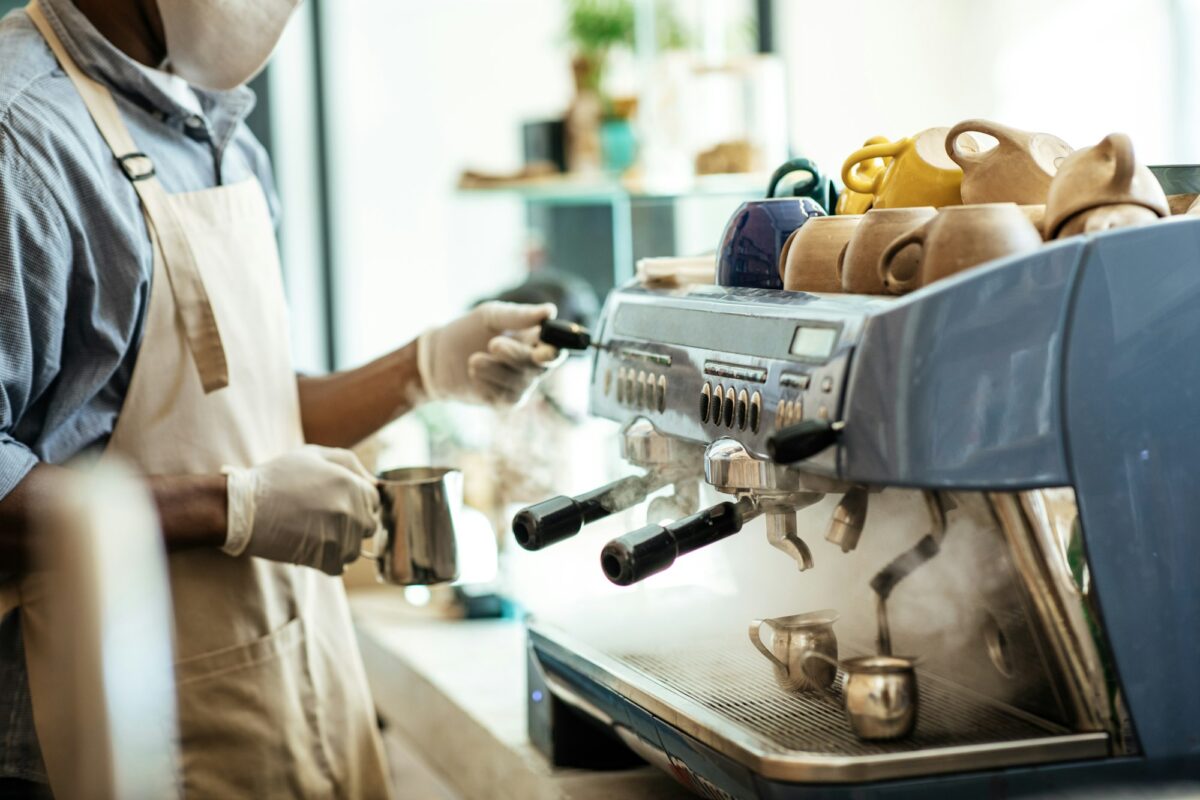 Work with coffee equipment in modern cafe